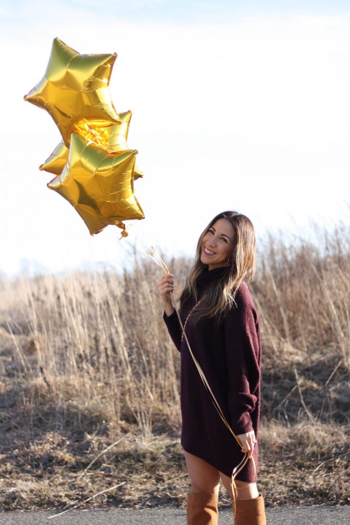 38 things about me featured by top Chicago life and style blog, House of Leo: image of a woman wearing an H&M sweater dress, Kelsi Dagger over the knee boots and Tory Burch shoulder bag.