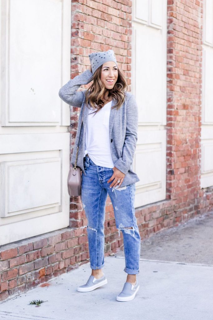Latest Spring Fashion with Yoox by top US fashion blog, House of Leo Blog: image of a woman wearing a gray blazer by Armani Jeans, gray VANS sneakers, Bart's beanie and American Eagle tomgirl jeans