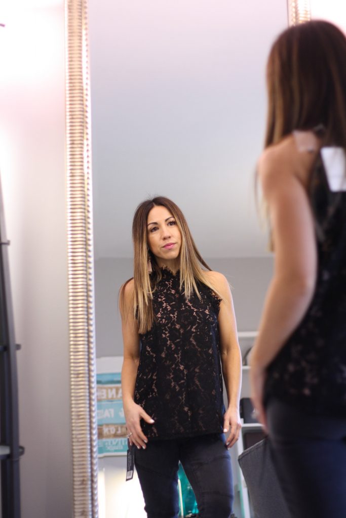 DAILYLOOK BOX REVIEW: SPRING FASHION featured by top New Jersey fashion blog, House of Leo: image of a woman trying on her new outfits from her Dailylook box